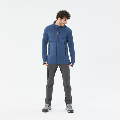 A photo of the Quechua Men's MH520 Hood Hiking Fleece Jacket in use