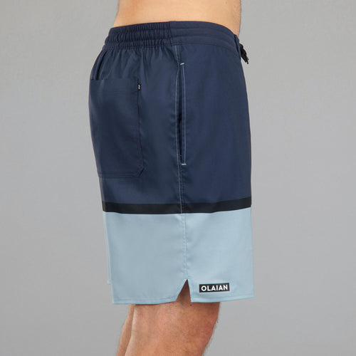 A photo of the Surfing Long Boardshorts 100 - TRENDY BLUE in use