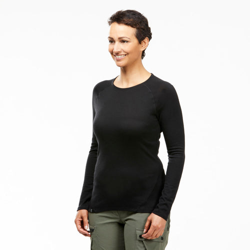 A photo of the Women's Long-sleeve 100% Merino Wool T-shirt - MT500 in use