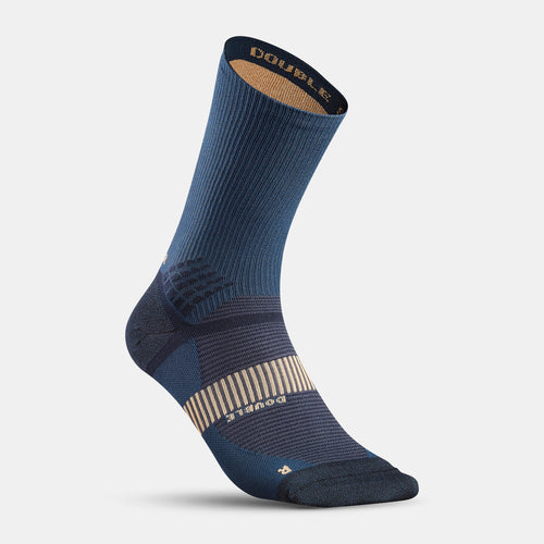 A photo of the Quechua MH 900 Hiking Double High Socks - 2 Pairs in use