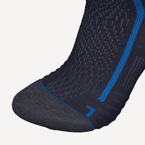 A photo of the Quechua SH500 Merino Wool Winter Mid Socks - 2 Pairs in use