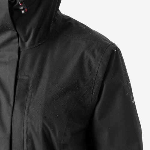 A photo of the Quechua Women's Hiking Waterproof Jacket NH500 - Green in use