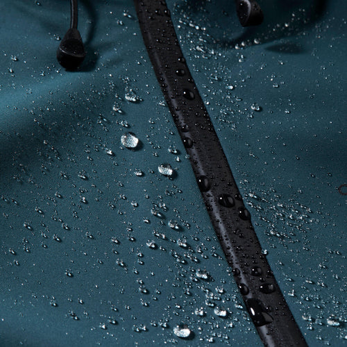 A photo of the Quechua Women's MH500 Waterproof Hiking Jacket in use