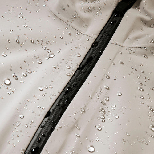 A photo of the Quechua Women's MH100 Lightweight Waterproof Hiking Jacket in use