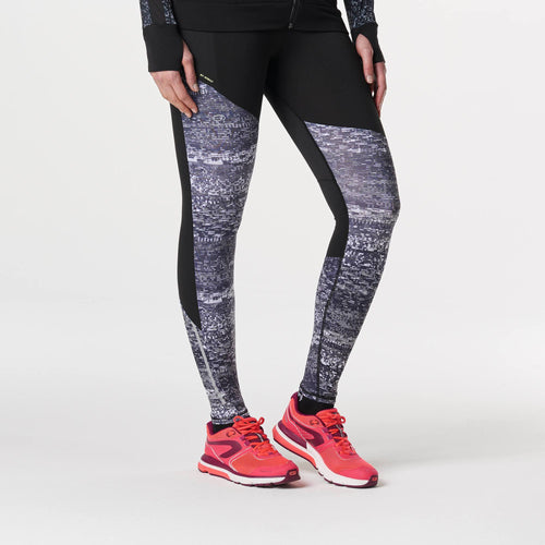 A photo of the Women's Running Tights - Run Warm+ Night in use