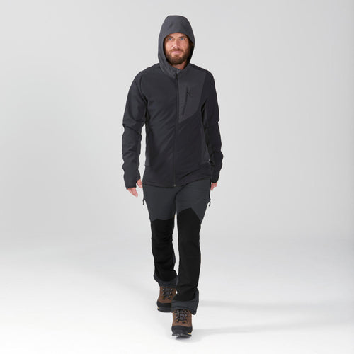 A photo of the Forclaz Trek 900 Softshell Hiking Windbreaker Men's in use