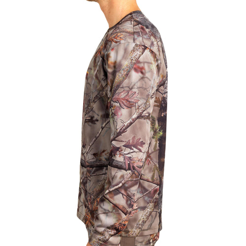 A photo of the HUNTING 100 BREATHABLE LONG-SLEEVED T-SHIRT - WOODLAND CAMOUFLAGE in use