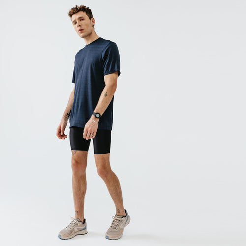 A photo of the Men's Running Breathable Tight Shorts Dry - black in use