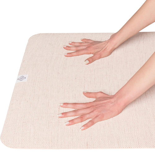 A photo of the Standard Thickness Natural Jute Rubber Yoga Mat with Carrying Strap 4mm in use