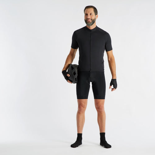 A photo of the Triban Padded Road Cycling & Touring Bike Bib Shorts Men's in use