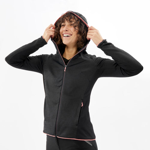 A photo of the Quechua MH920 Fleece Hiking Jacket Women's in use