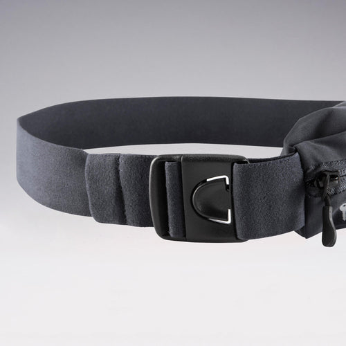 A photo of the Kalenji Adjustable Running Belt for Any Size of Smartphone and Keys in use
