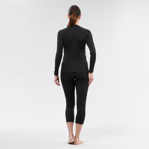 A photo of the Women's Ski Base Layer Top - BL 100 - Black in use