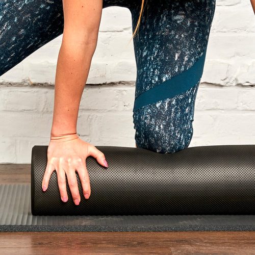 A photo of the Nyamba Foam Roller 35.4'' x 5.9'' in use