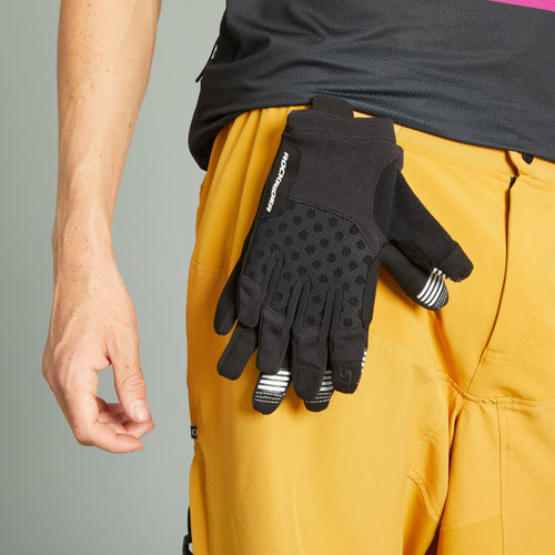 A photo of the Rockrider ST500 Mountain Bike Gloves Adult in use