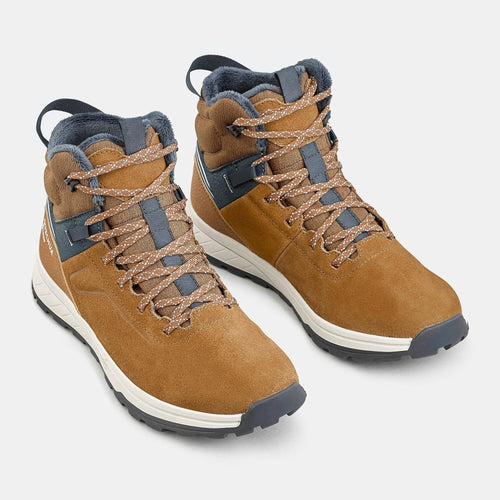 A photo of the Kids' warm and waterproof SH500 lace-up leather hiking shoes - size 2.5 - 5.5 in use