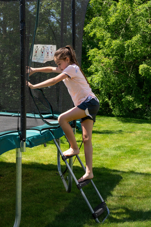 A photo of the Domyos 12 ft and 14ft Universal Trampoline Ladder in use