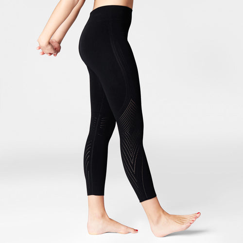 A photo of the Domyos Perforated Second Skin Tech Yoga Leggings Women's in use