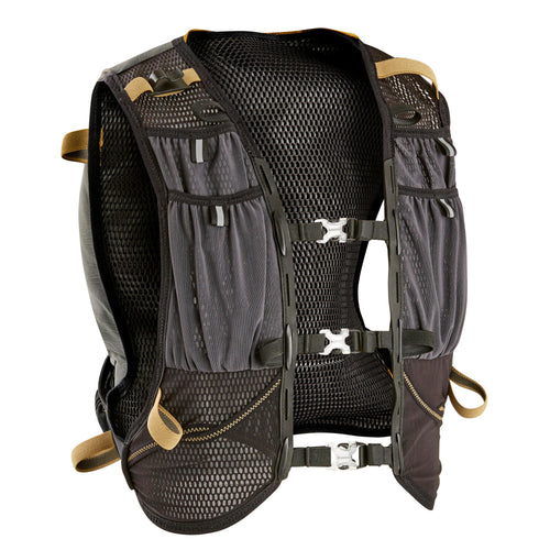 A photo of the 10L TRAIL RUNNING BAG UNISEX - BLACK/BRONZE - Sold with 1L water bladder in use
