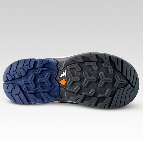 A photo of the Quechua Crossrock Mid Waterproof Lace-Up Hiking Shoes Kids' in use