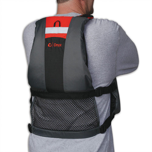 A photo of the Onyx Movevent Dynamic Adjustable Life Jacket PFD w Pocket Adult User >90lb in use