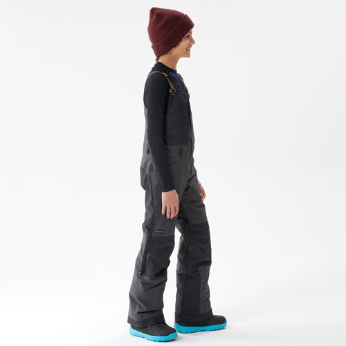 A photo of the Dreamscape SNB Bib 500 Kids' Snowboarding and Skiing Bib in use