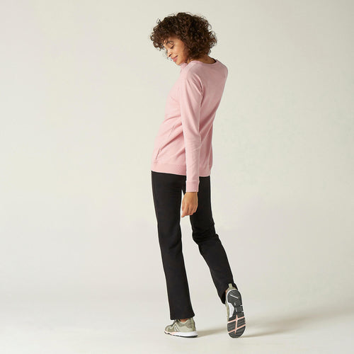 A photo of the Women's Fitness Sweatshirt 100 - Pink in use