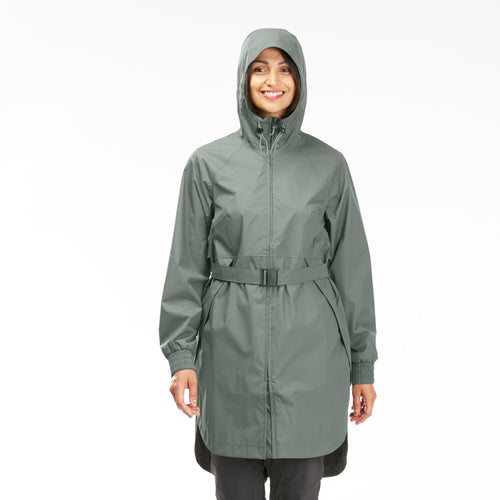 A photo of the Quechua Women's Long Waterproof Rain Jacket in use