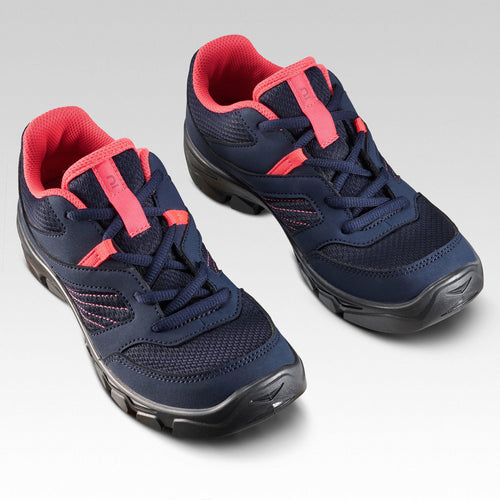 A photo of the Quechua MH100 Low Lace-Up Hiking Shoes Kids' in use