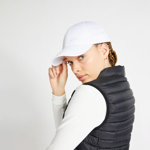 A photo of the Inesis Ultralight Down Golf Packable Puffer Vest Women's in use