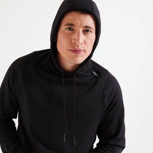 A photo of the Men's Breathable Essential Fitness Hoodie - Black in use