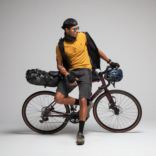 A photo of the Triban Gravel Cycling and Touring Merino Wool Polo Shirt in use