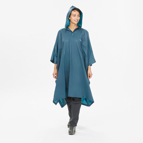 A photo of the Forclaz Arpenaz 10 L Hiking Rain Poncho in use