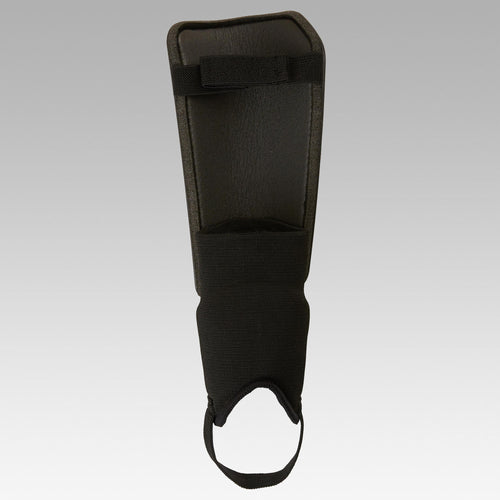 A photo of the Essential 140 Soccer Shin Pads Kids' in use