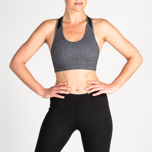 A photo of the Domyos 100, Cardio Workout Sports Bra in use