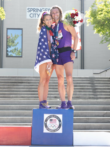 Robyn and Nick standing on the 20k racewalk podium