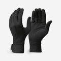 Pair of black gloves on a light gray background