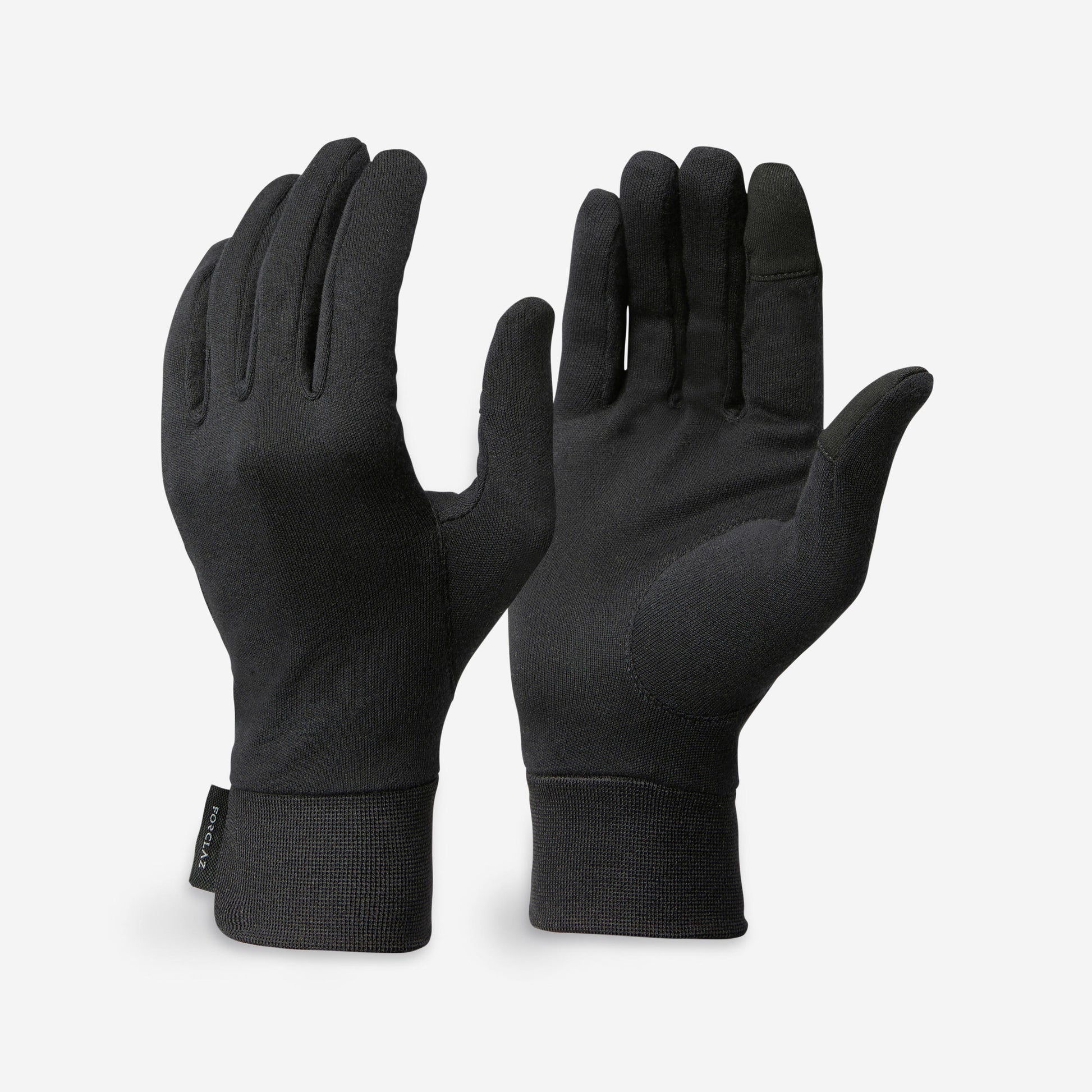 Pair of black gloves on a light gray background