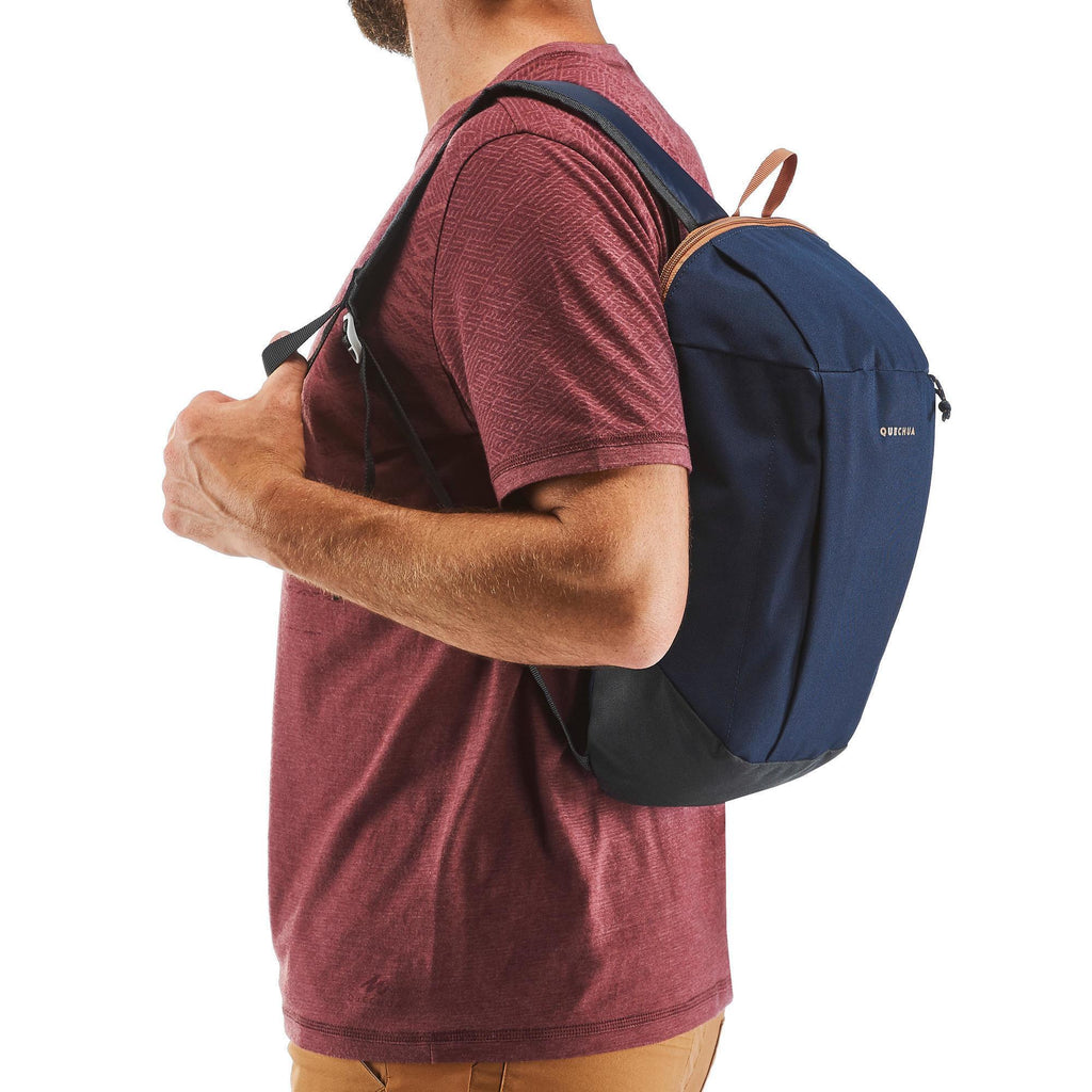 Person wearing a blue backpack on a white background