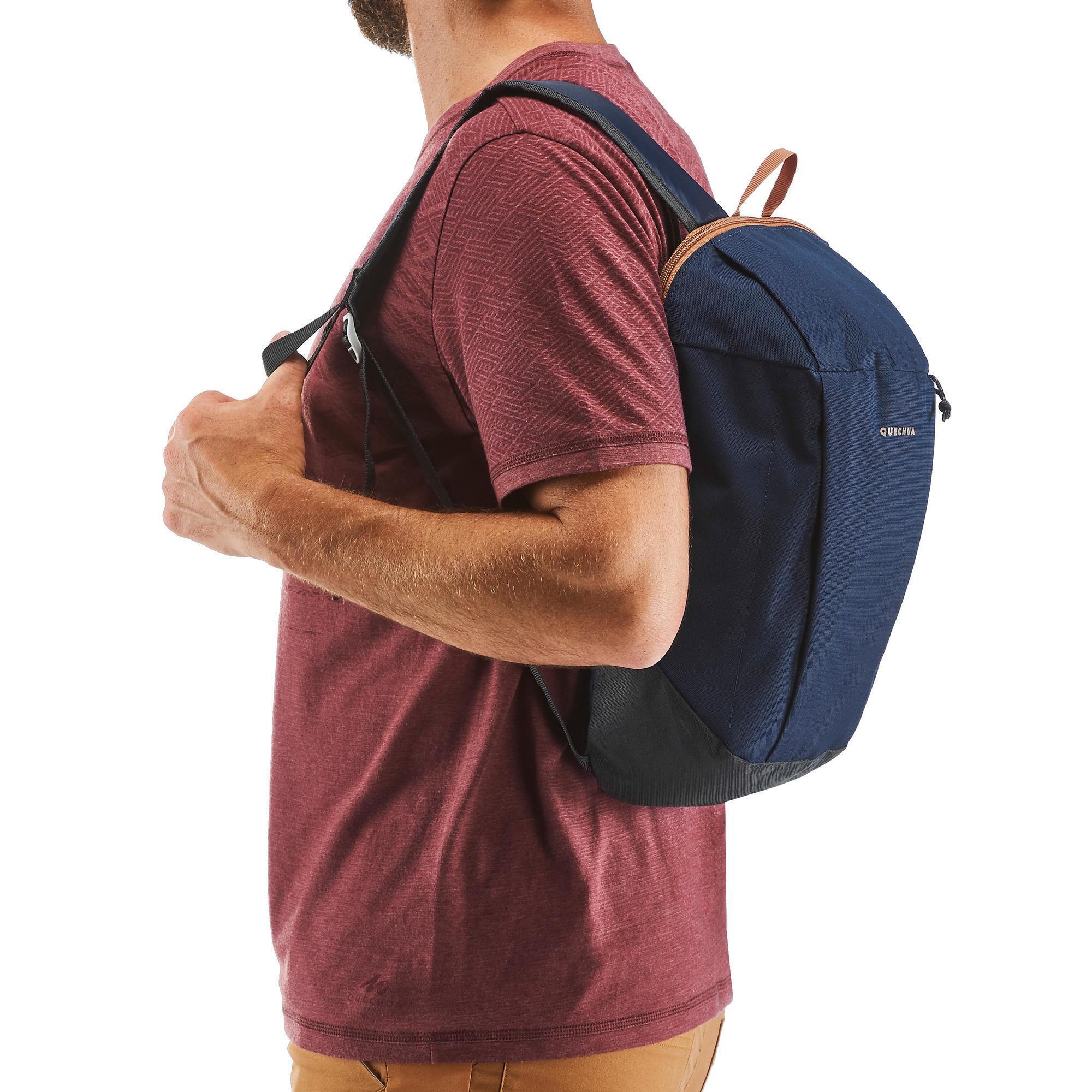 Person wearing a blue backpack on a white background