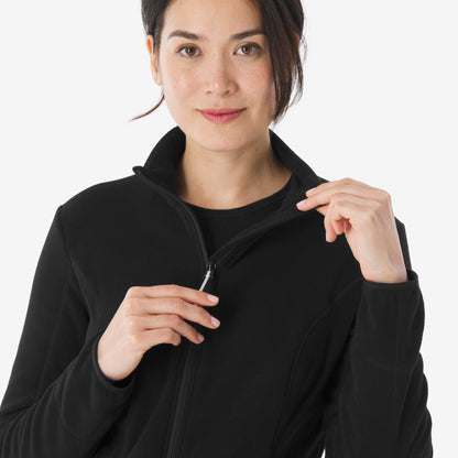 Woman wearing a black jacket with a white background
