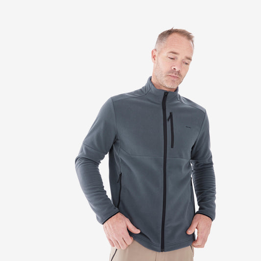 Man wearing a gray jacket with a black zipper on a white background