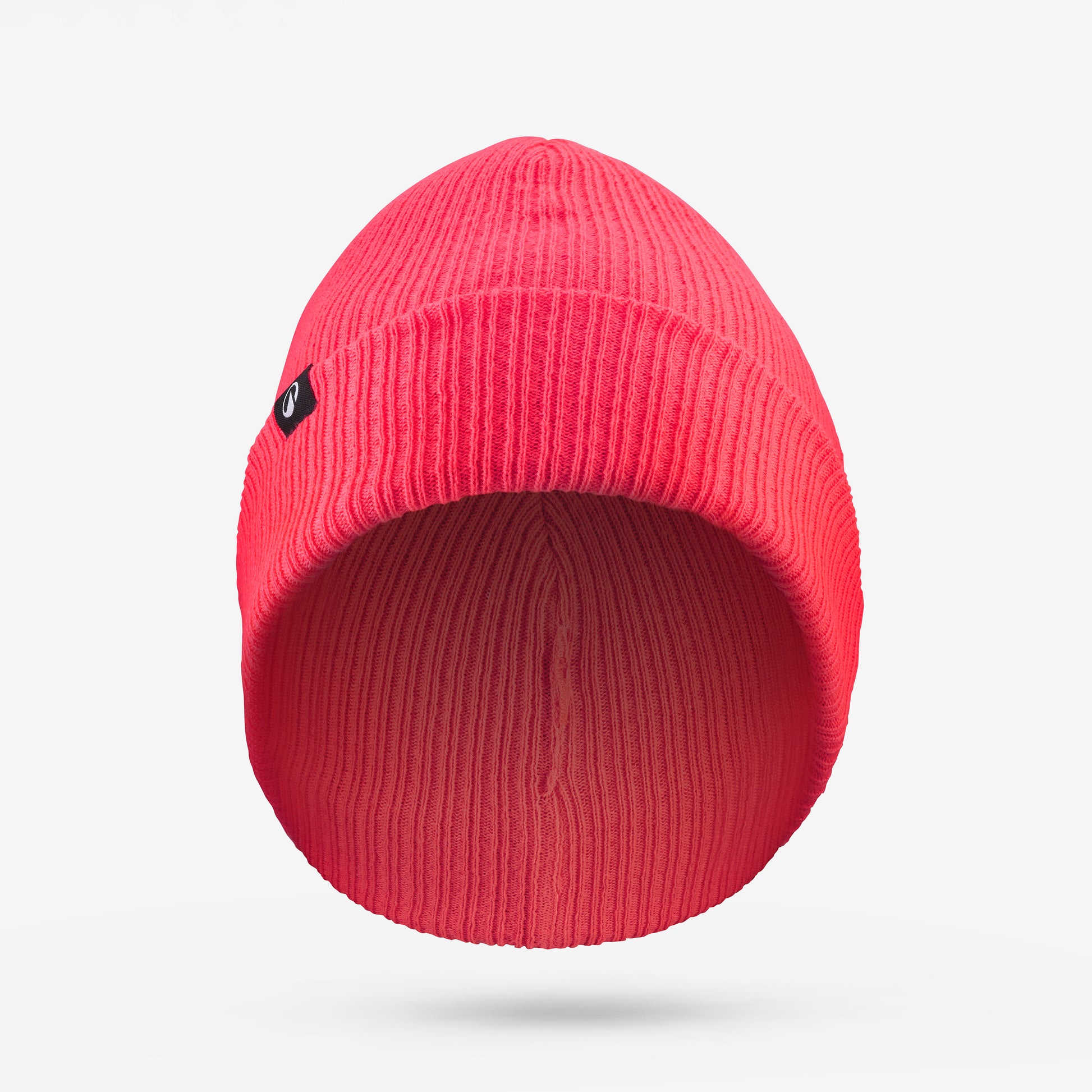 Red beanie hat with a small logo on a light gray background