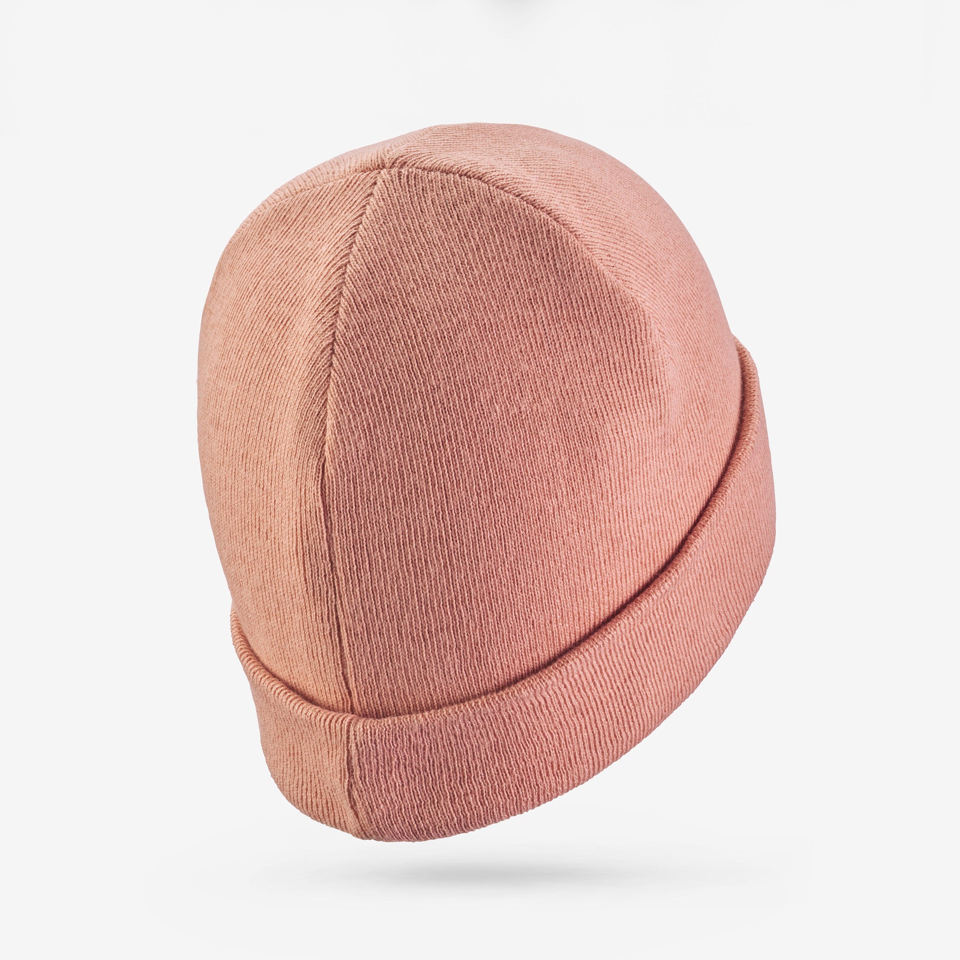 Pink beanie hat on a white background