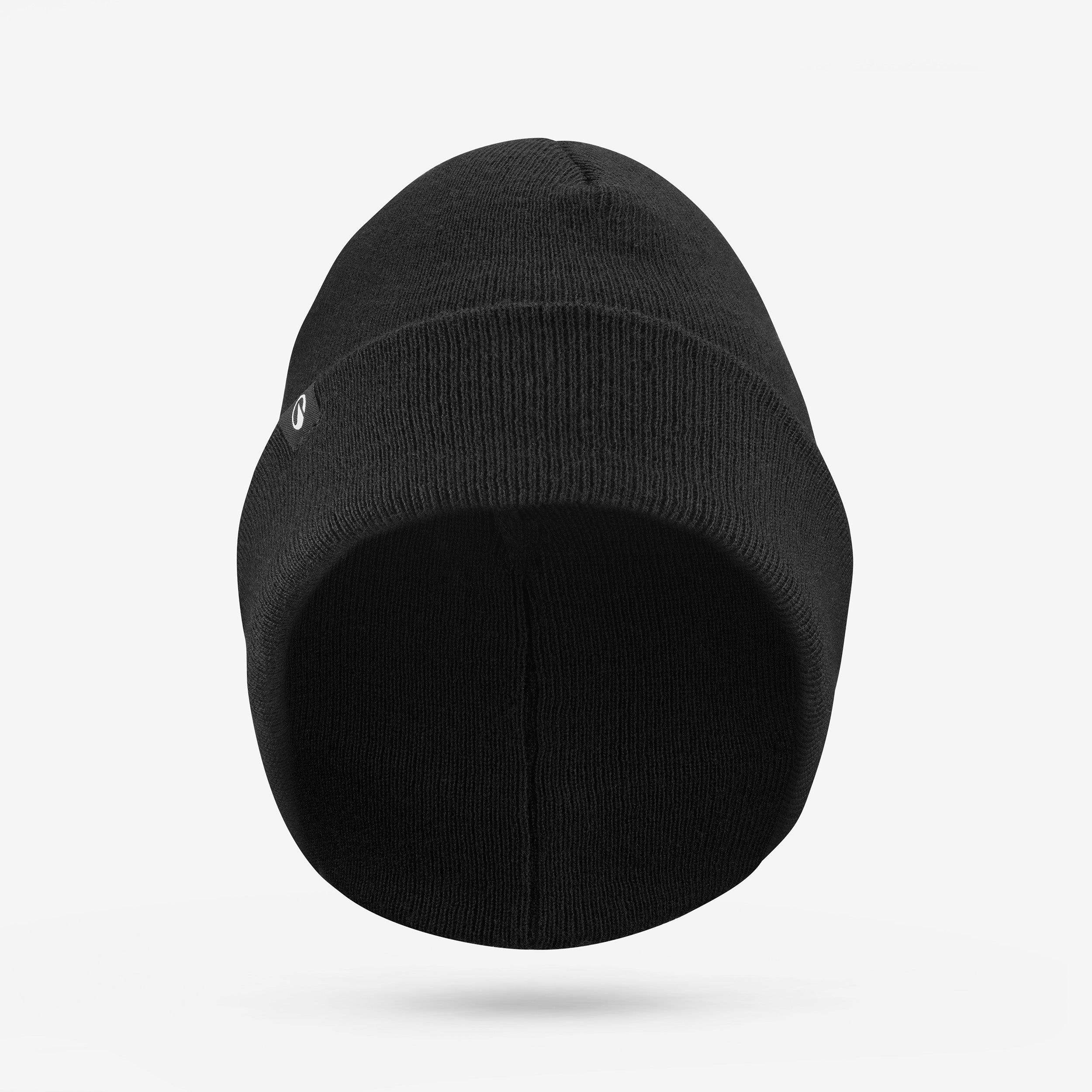 Black knit beanie on a light gray background